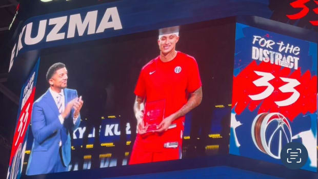 Kyle Kuzma receives the NBA Cares Bob Lanier Community Assist Award